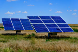 two large solar panels in a field