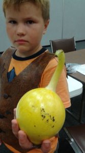 boy holding a gourd