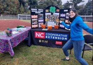 Kaitlyn Lamaster shows off an NCCE display at an event.